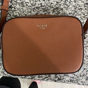 Brown cross body purse.